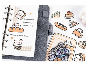 Cute cartoon pet and bread PET stickers with grey felt binder notebook on white background