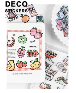 Close-up of cute fruit and food deco stickers on a white notebook page for journaling