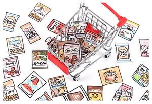 Macro detail of cute Japanese snack stickers with mini shopping cart prop