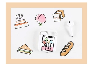 Detail of cute lollipop cartoon sticker on white earphone case with food illustrations