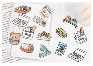 Detailed view of cute PET food stickers with bread and donut motifs for journaling