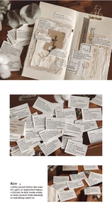 Detailed view of vintage dictionary word stickers with torn edges for scrapbook decoration