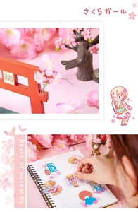 Detailed view of translucent PET cherry blossom girl stickers on a grid notebook and diorama