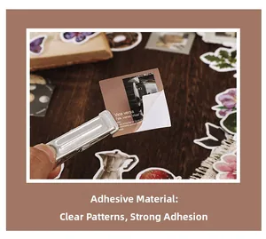 Detail of vintage adhesive stickers with floral and butterfly motifs on a wooden background