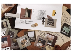 Macro shot of Morandi vintage photography stickers on a rustic wooden desk with dried petals