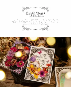 Macro detail of retro collage cards with dried flowers and vintage fairy motifs