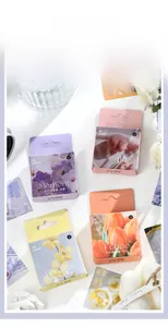 Detailed view of floral deco stickers in four boxes with elegant flower props