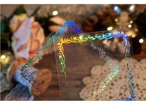 Macro view of holographic floral PET stickers with laser borders for retro DIY journals