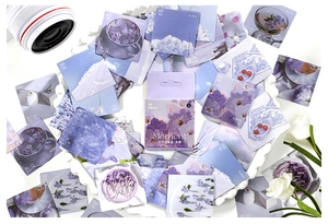 Detail of purple floral decorative stickers with a box set for scrapbook journals
