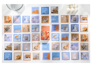 Detailed view of 30-piece artistic floral sticker set and orange decorative gift box