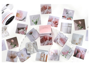 Flat lay of 45-piece floral stickers including roses and tulips with a pink box