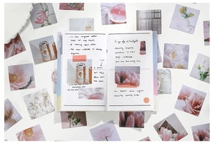 Flat lay of floral washi stickers on planner with matte finish and soft pink tones