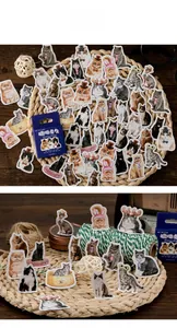 Close-up of cat stickers in creative outfits scattered on a rustic woven background