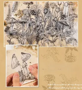 Macro view of vintage vellum paper stickers with black and white botanical line art designs