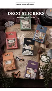 Vintage decorative paper stickers displayed on aged books with a rustic aesthetic