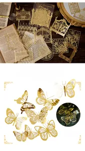 Detailed 3D laser-cut gold lace butterfly and vintage window frame paper for DIY journaling