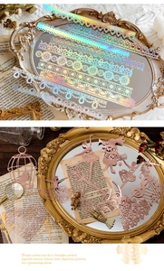 Detailed laser-cut gold foil lace paper with retro ballerina and floral motifs for journaling