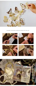 Detail of 3D gold butterfly stickers with seamless adhesive dots for wall and DIY journals