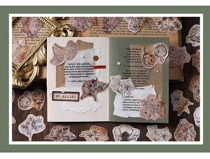 Macro detail of vintage botanical stickers with floral patterns on a scrapbook page