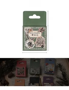 Macro detail of vintage traveler deco stickers with size measurements and floral designs
