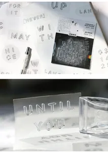 Detail of transparent glass-like alphabet stickers on a glass container for DIY journaling