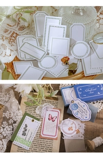 Close-up of vintage butterfly and floral paper ephemera with blue gold foil matchbox
