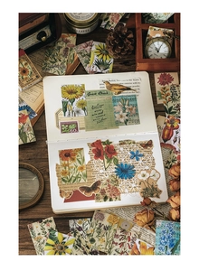 Detailed arrangement of vintage floral stickers and antique ephemera for journaling DIY