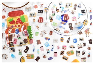 Detailed view of colorful PET lifestyle stickers with cute cartoon food and travel motifs
