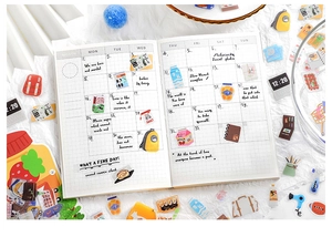 Detailed view of colorful PET lifestyle stickers applied on an open DIY journal page
