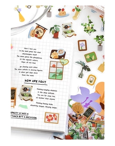 Detail of PET stickers with potted plants and retro records on grid journal pages