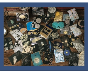 Flat lay of vintage astronomical stickers featuring moon phases and retro star charts