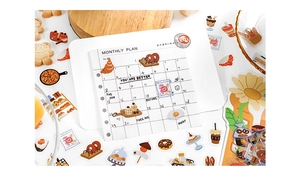 Close-up of PET food stickers and monthly plan layout for DIY scrapbooking decoration