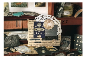Macro view of vintage astronomy washi stickers featuring moon phases and celestial maps