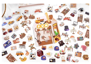 Flat lay of PET stickers featuring cozy home furniture, instruments, and cute cats for journaling