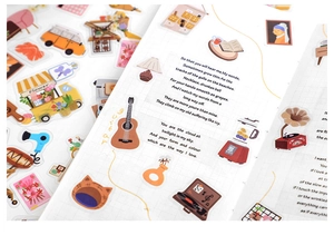 Detail showing vintage illustrations of guitar and gramophone on PET stickers for scrapbooking