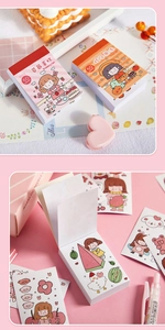 Close-up of cute cartoon dessert themed sticker books featuring strawberry cake designs
