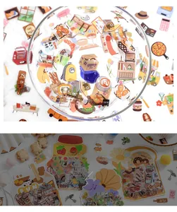 Macro shot of lifestyle PET stickers featuring coffee and food icons for DIY planners