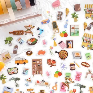 Flatlay of PET stickers with plants, coffee and furniture for creative DIY scrapbooking
