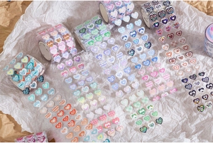 Macro detail of heart-shaped PET decorative tapes with leopard print and geometric patterns