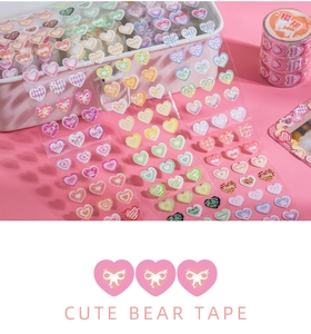 Detail of heart-shaped laser PET decorative stickers and cherry soy milk washi tape