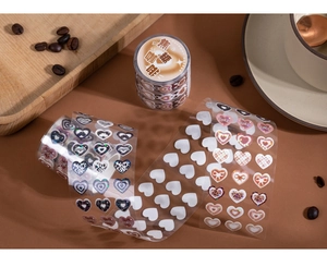 Detail of caramel coffee heart PET stickers with leopard patterns and lucky text for journaling