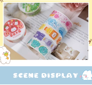 Macro shot of assorted washi tape rolls with cute dessert and animal illustrations