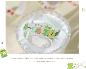 Detail of cute washi tape with cactus and succulent illustrations in a glass bowl