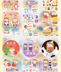 Close-up of cute cartoon girl stickers and colorful washi tape for journaling decoration