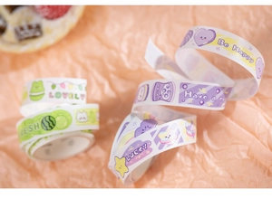 Detail of cartoon washi tape rolls featuring colorful patterns for DIY journaling and scrapbooking