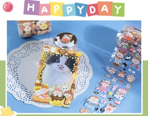 Close-up of cute cartoon cat-themed washi tape and card holder on blue lace background