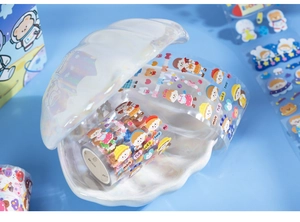 Detail of cute cartoon washi tape with weekday initials in a seashell display