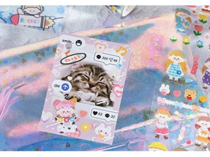 Detail of cute cartoon girl stickers with laser iridescent storage bag for journaling