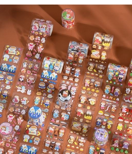 Close-up of PET decorative tapes featuring cute cartoon girls and cosmic planet motifs