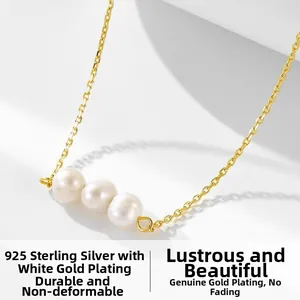 Detailed close-up of three white pearls on a 925 sterling silver gold plated chain
